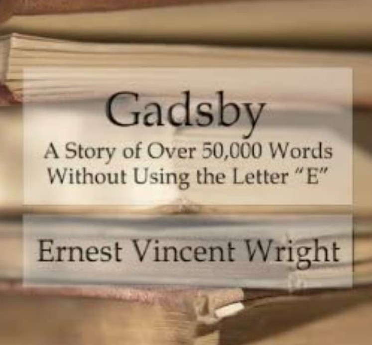 Photo of the cover of a novel called Gadsby: A Story of Over 50,000 Words Without Using the Letter "E" by Ernest Vincent Wright. The novel cover shows the title, subtitle, and author of the book in black serif typography over a picture of a stack of old yellowing hardcover books.